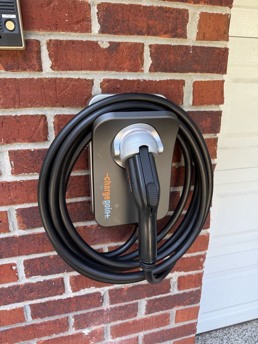 EV charger installed on a brick wall